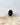 This picture shows a gorgeous sterling silver (925 silver) ring. The ring is adorned with a deep black onyx gem. The ring is presented on a white background and is shown on a rock. This image offers a close-up of the ring.