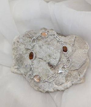 Silver bracelet with orange kyanite and topaz
