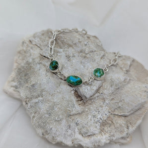 Silver bracelet with three turquoise