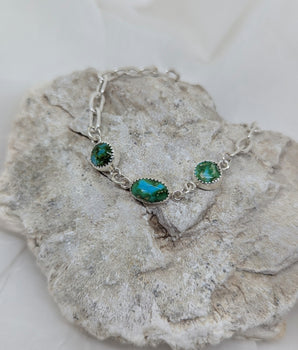 Silver bracelet with three turquoise