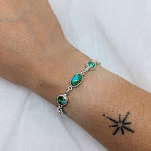 Silver bracelet with three turquoise