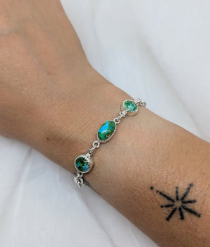 Silver bracelet with three turquoise